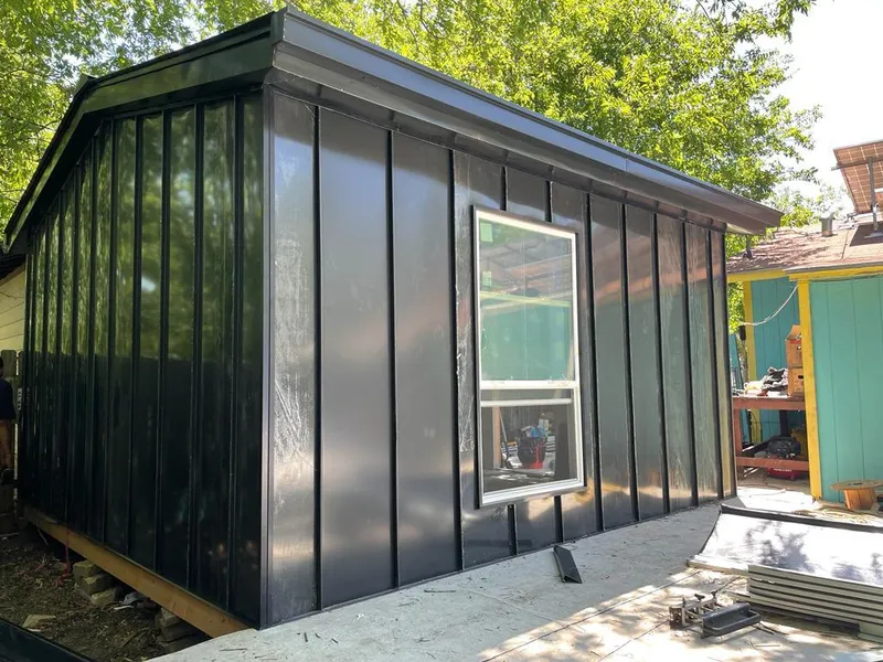 Black standing seam metal wall panels for Roof Inspection in Battlement Mesa